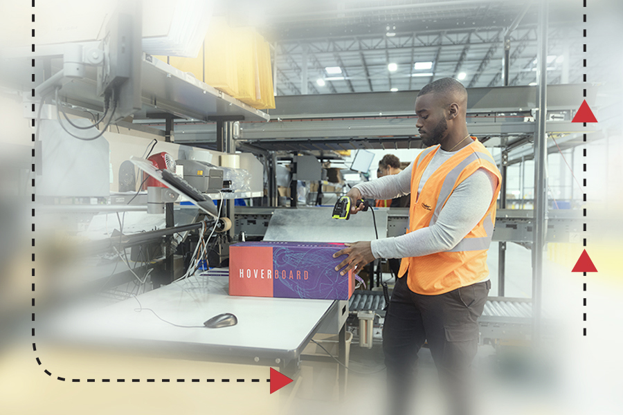 A Ryder warehouse worker processing returns in a warehouse